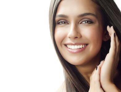 patient smiling after receiving dental implants