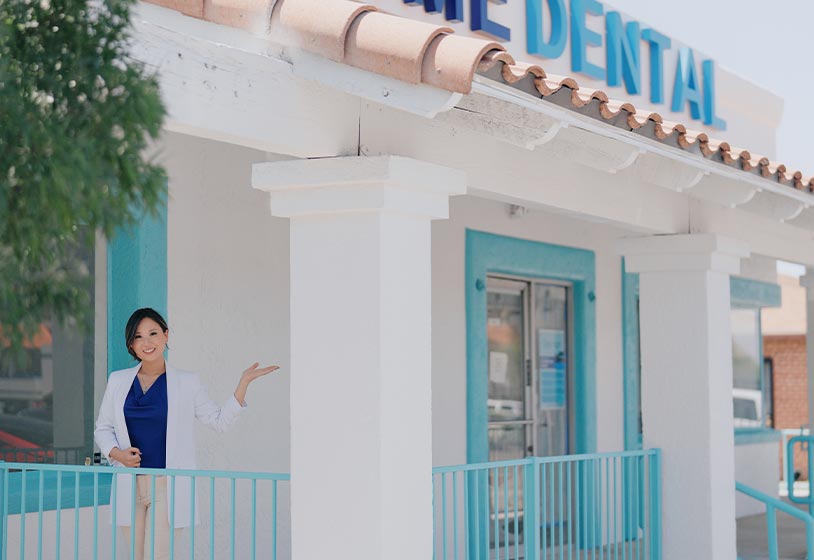 Dr. Sarah Kym in front of her Tucson dental office Prime Dental