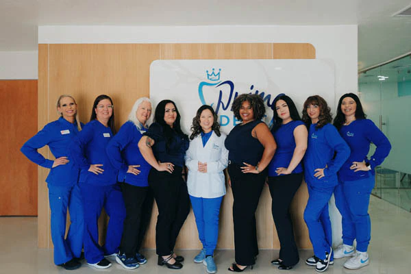 Prime Dental team posing together in office